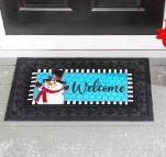 A Snowman Sassafras interchangeable Doormat by a front door